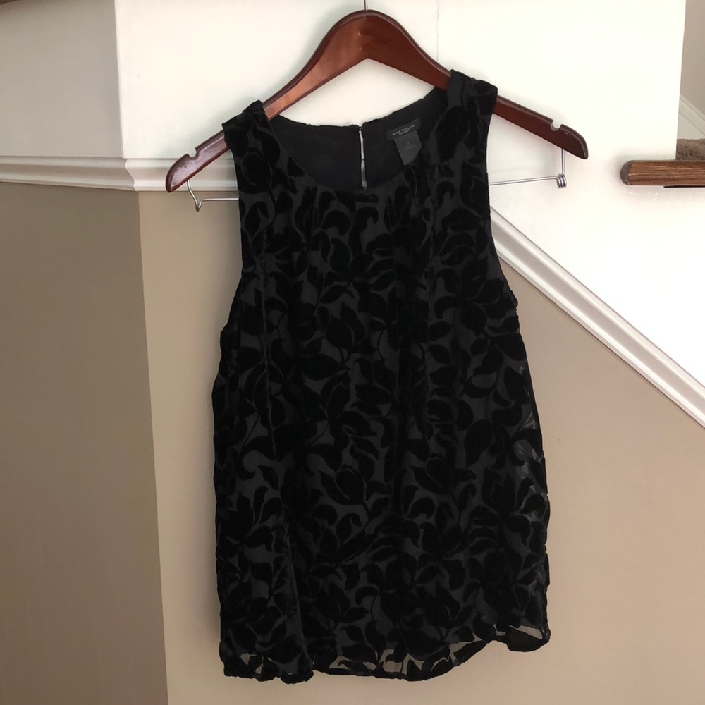 Dressy top - great for date nights. Lined. Thin velvet embossed top layer